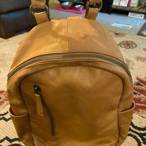 A very nice leather backpack purse